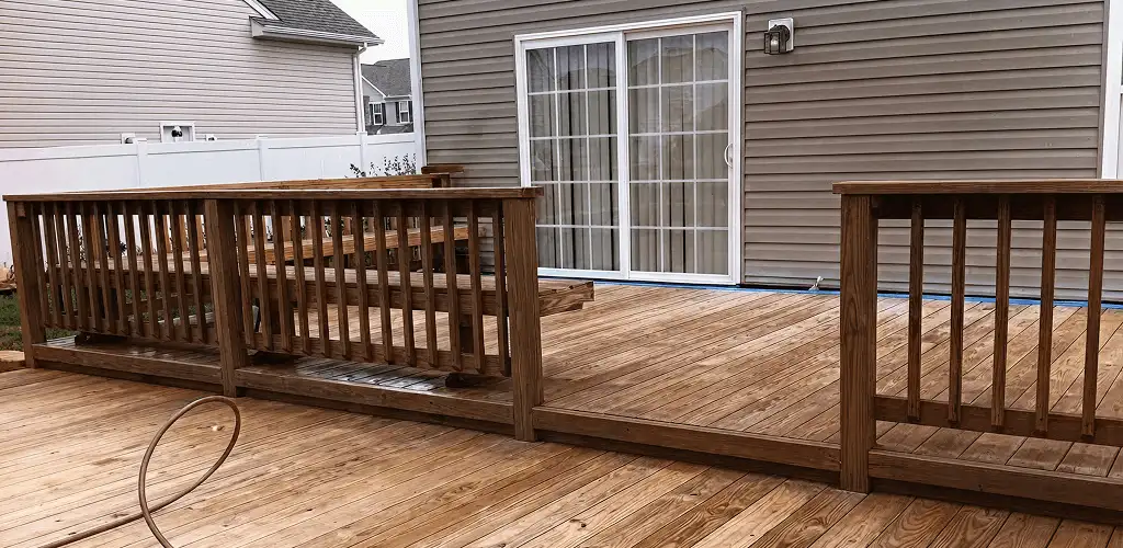 Deck sealing service protecting a backyard wood deck and railings in San Antonio, TX