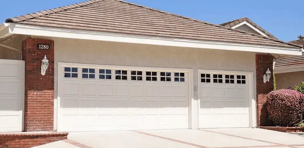 Residential garage door repair service for a double garage door in San Antonio, TX