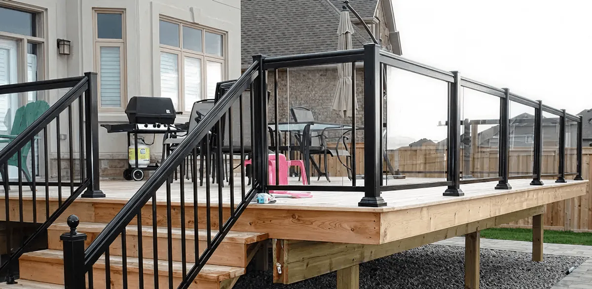 Handrail installation on a deck staircase for safety and code compliance in San Antonio, TX