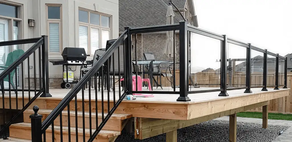 Handrail installation on a deck staircase for safety and code compliance in San Antonio, TX